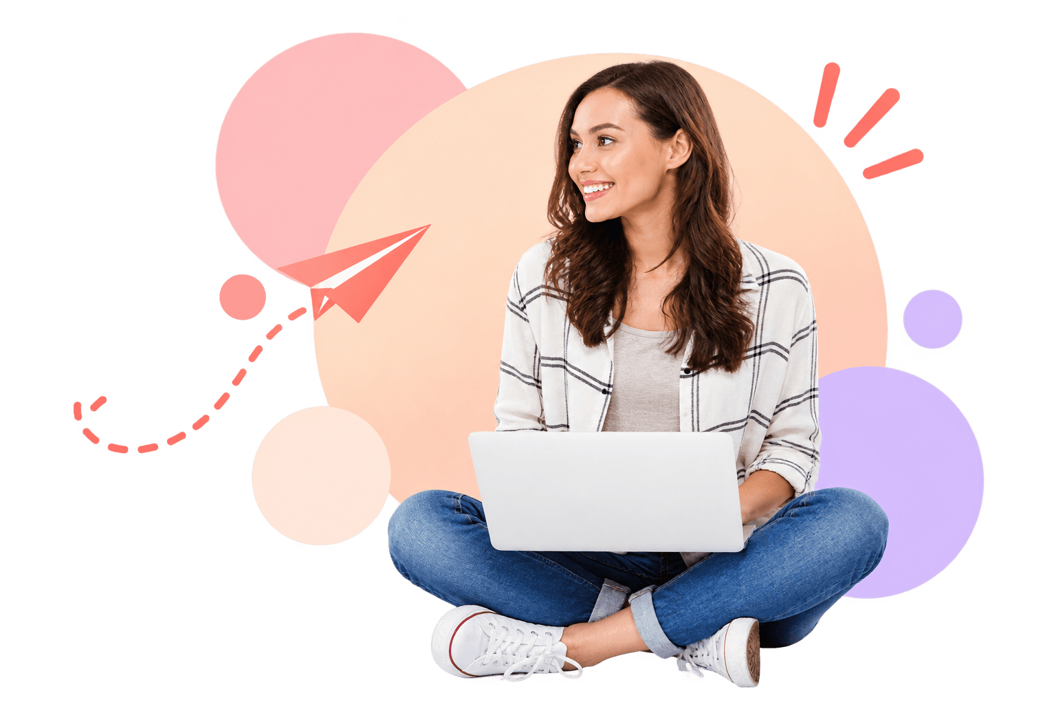 A smiling engineer sitting cross-legged with her laptop