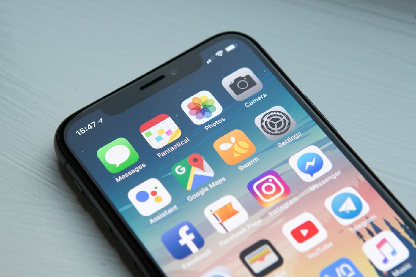 A smartphone home screen showing app icons